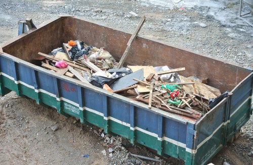 Professional house clearance team removing items from a home in Archway