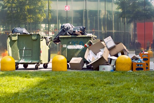 Exterior view of commercial waste sorting area in Archway with bins