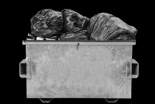 Electric low-emission van making a collection in a London borough street