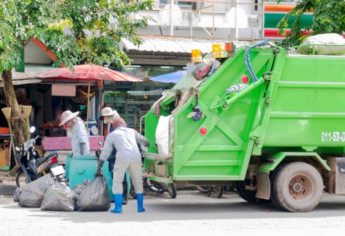 Transfer station operations with workers sorting commercial recycling